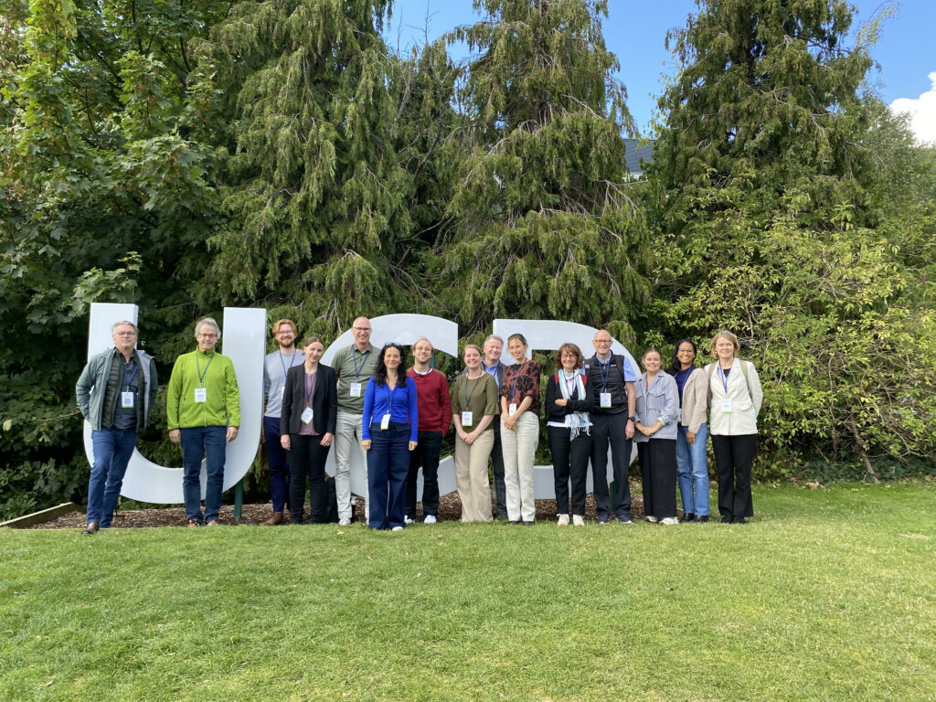 TheRaCil consortium members posing in front of UCD sign